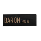 A custom-designed black concrete house entrance sign with wooden lettering - HOUSE series