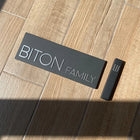 Designed black concrete entrance door sign with silver lettering - Family series