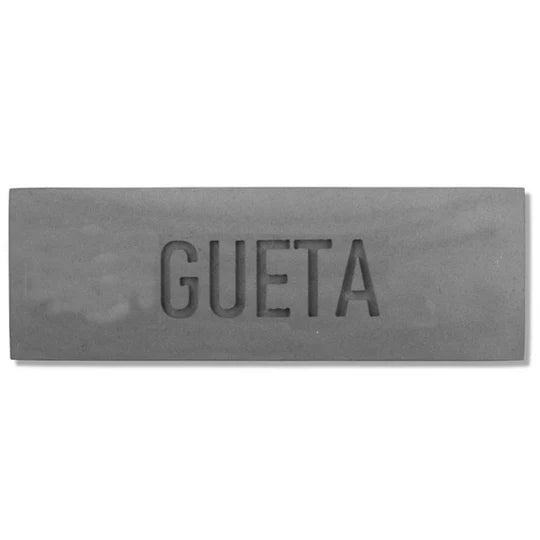 A designed sign for the entrance to a house with names made of natural concrete in gray with engraving - Concrete Chic series 