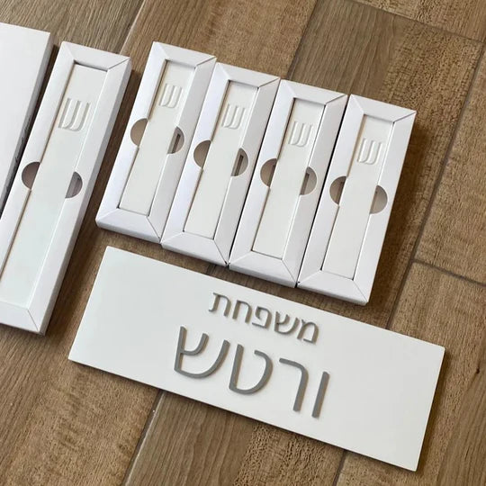 A personalized family sign with engraved names in white concrete with silver lettering (Copy) 