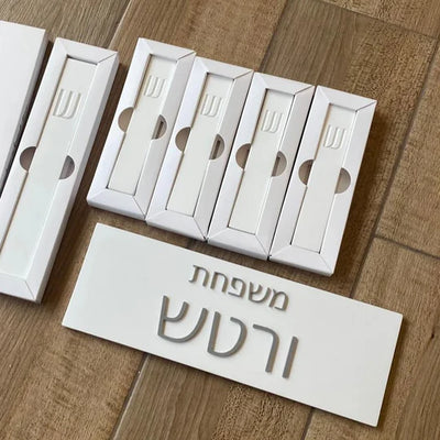 A personalized family sign with engraved names in white concrete with silver lettering (Copy) 