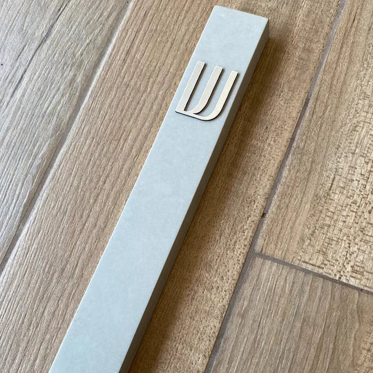 A design sign for a door made of clean concrete in gray with silver lettering - Israel series (Copy)  Door Sign + Mezuzah Case