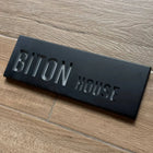 A personalized home and office sign made of clean, black concrete with engraving - Israel Series