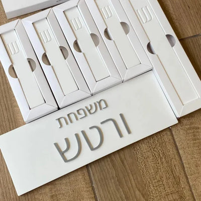 A personalized family sign with engraved names in white concrete with silver lettering (Copy) 